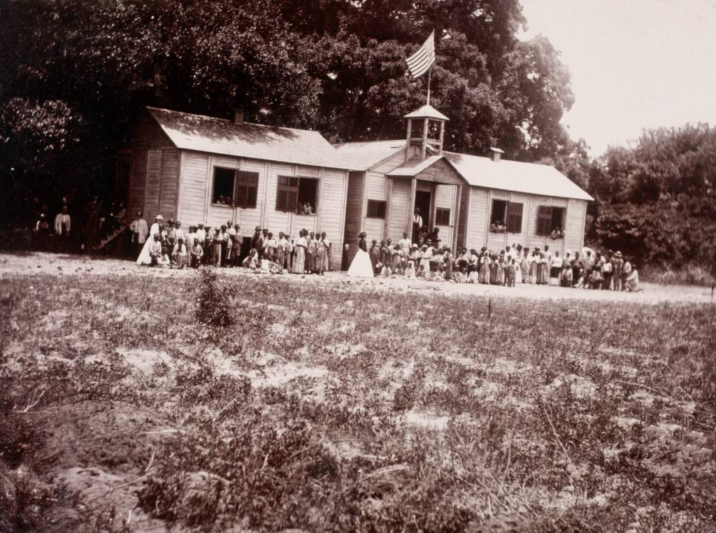Students and teachers stand outside the Freedman's Bureau School in Beaufort, South Carolina, circa 865. Following the end of the Civil War, several schools opened up for black families - and literacy rates climbed steadily. -Photo Corbis/Getty Images